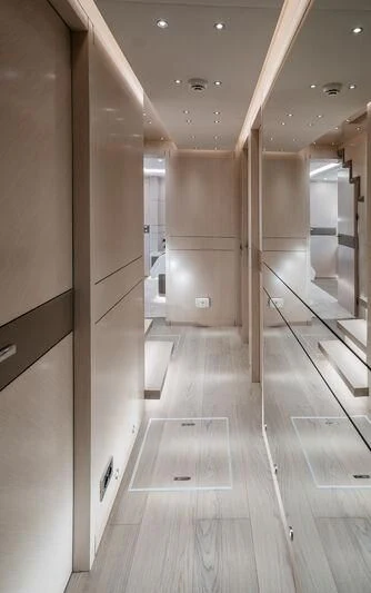 a hallway with a wood floor and white walls aboard LEMANJA Yacht for Sale