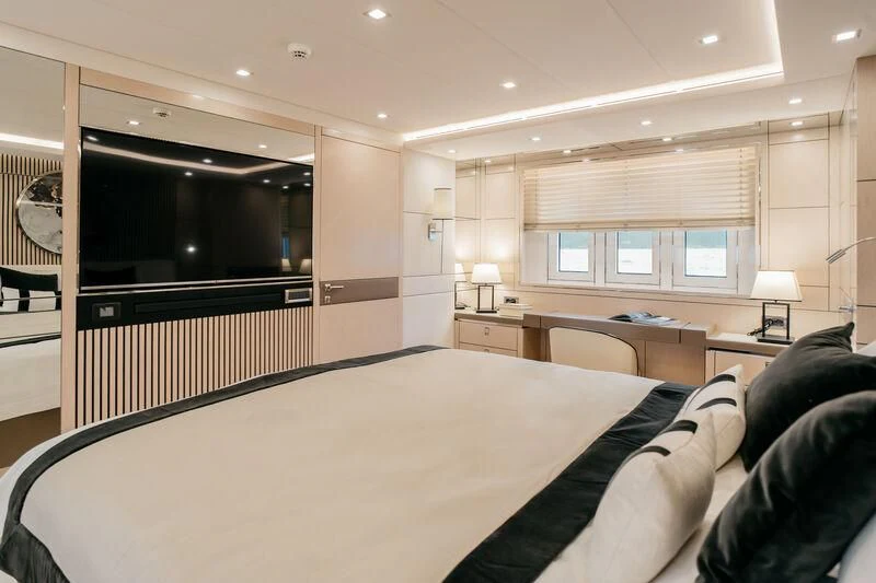 a bedroom with a large bed aboard LEMANJA Yacht for Sale