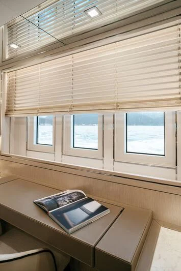 a laptop on a table aboard LEMANJA Yacht for Sale