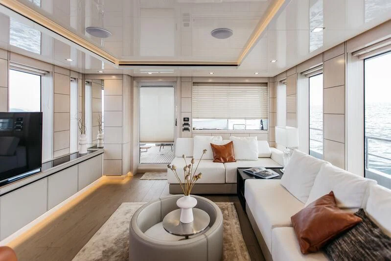 a living room with a couch and a table aboard LEMANJA Yacht for Sale