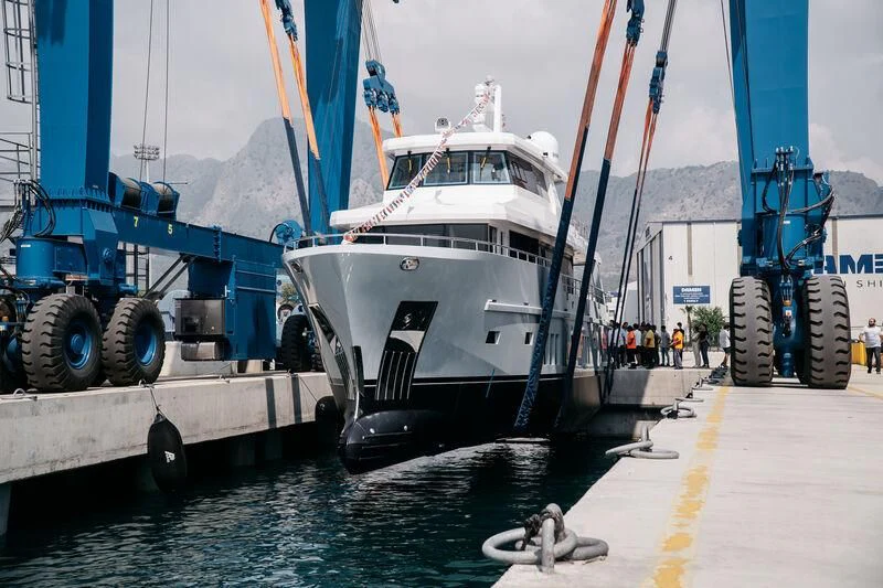 a large white boat is parked next to a large boat aboard LEMANJA Yacht for Sale