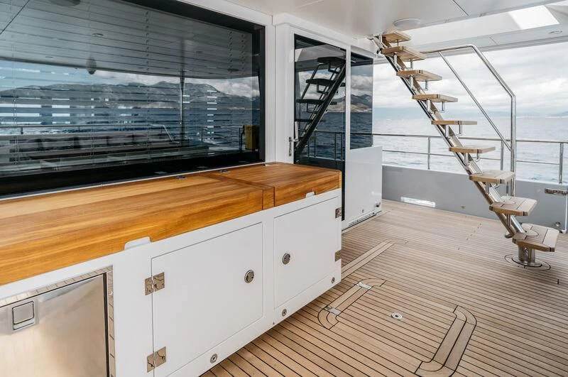 a room with a wood floor and a staircase aboard LEMANJA Yacht for Sale