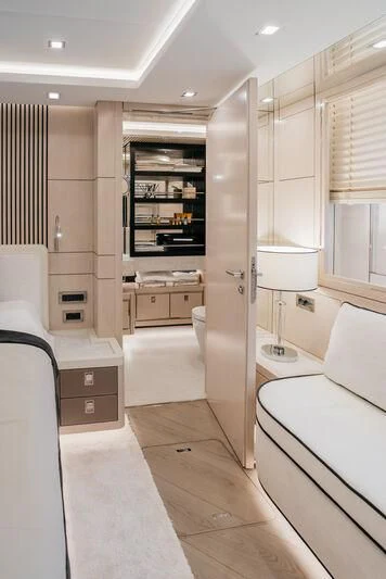 a room with a bed and a shelf with drawers aboard LEMANJA Yacht for Sale