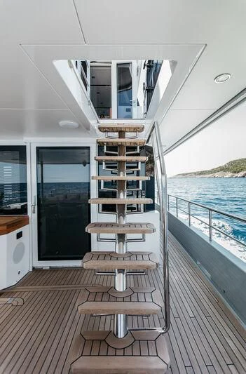 a wooden chair on a boat aboard LEMANJA Yacht for Sale