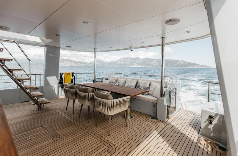 a room with a table and chairs aboard LEMANJA Yacht for Sale