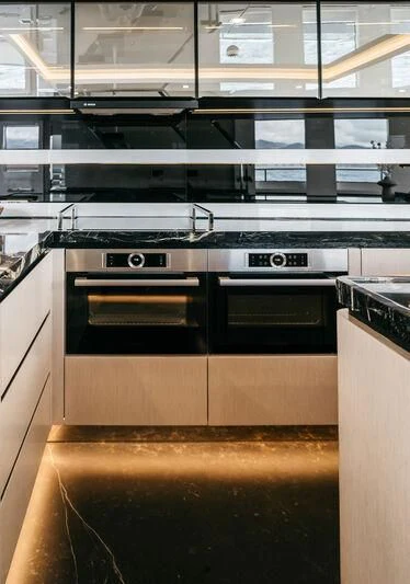 a kitchen with a stove and oven aboard LEMANJA Yacht for Sale
