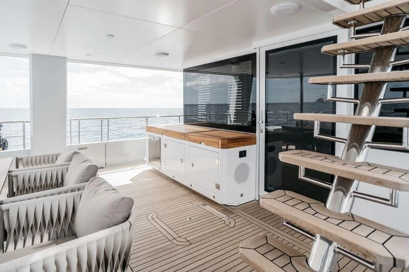 a room with a bed and a desk aboard LEMANJA Yacht for Sale