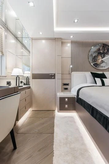 a bedroom with a mirror and a bed aboard LEMANJA Yacht for Sale