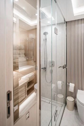 a bathroom with a glass shower aboard LEMANJA Yacht for Sale
