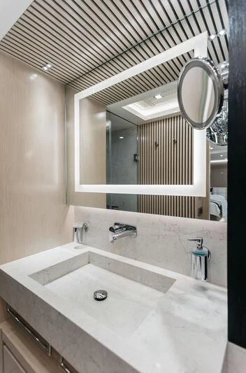 a bathroom with a large mirror aboard LEMANJA Yacht for Sale