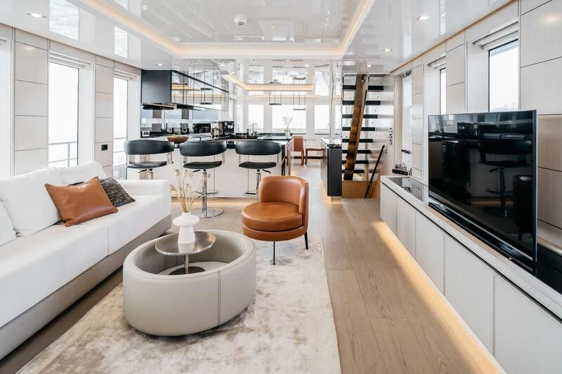 a living room with a fireplace aboard LEMANJA Yacht for Sale