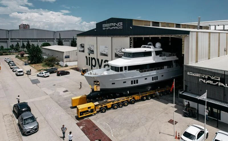 a large white boat on a trailer aboard LEMANJA Yacht for Sale