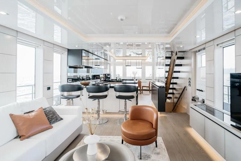 a living room with a large open concept aboard LEMANJA Yacht for Sale