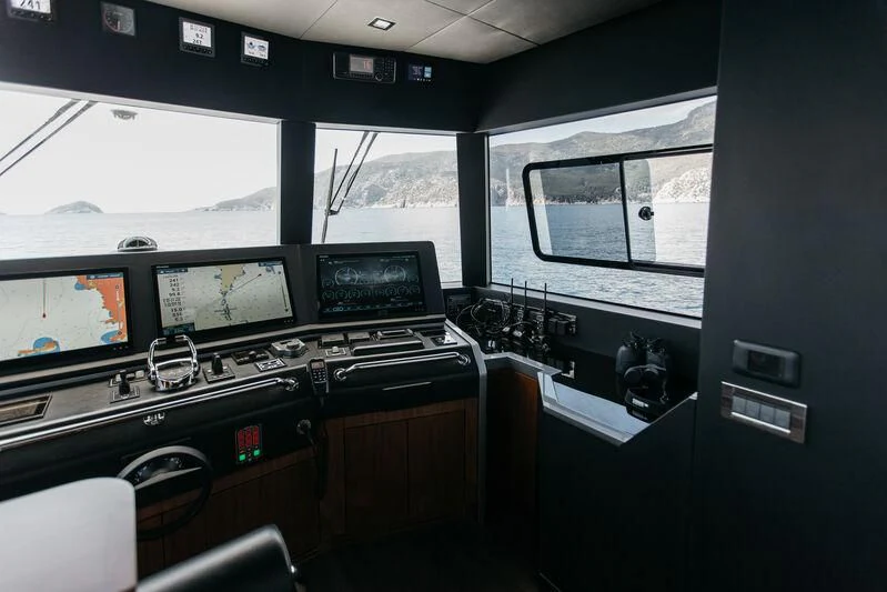 a room with many monitors and electronic equipment aboard LEMANJA Yacht for Sale