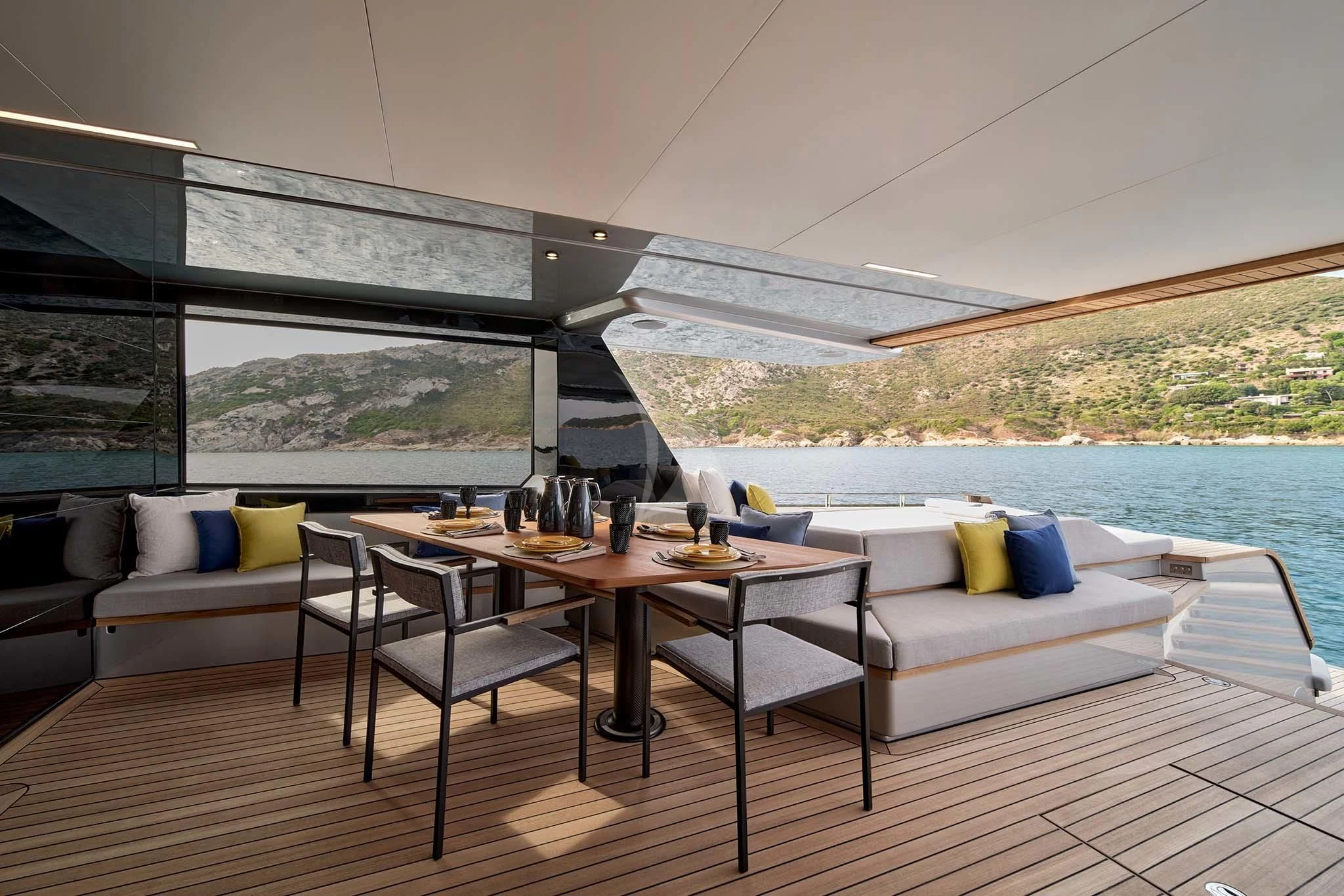 a room with a table and chairs aboard WHY 200 Yacht for Sale