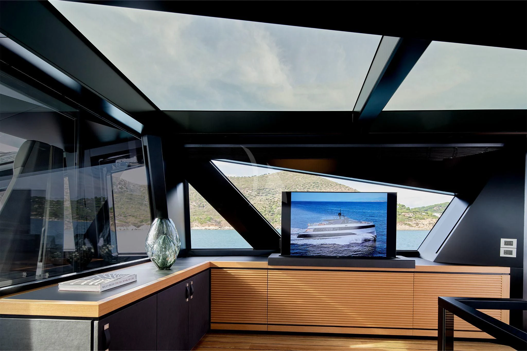 a room with a desk and a window aboard WHY 200 Yacht for Sale