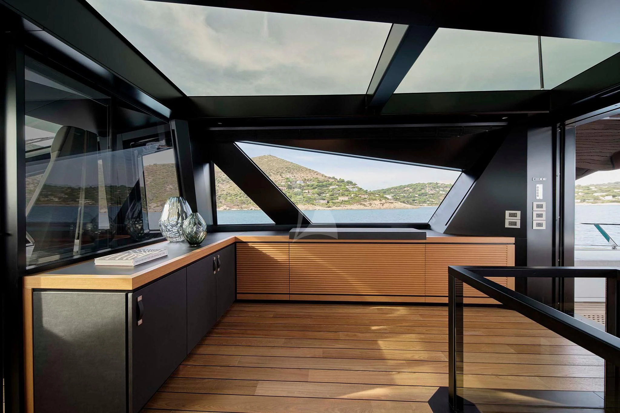 a room with a large window and a wood floor aboard WHY 200 Yacht for Sale