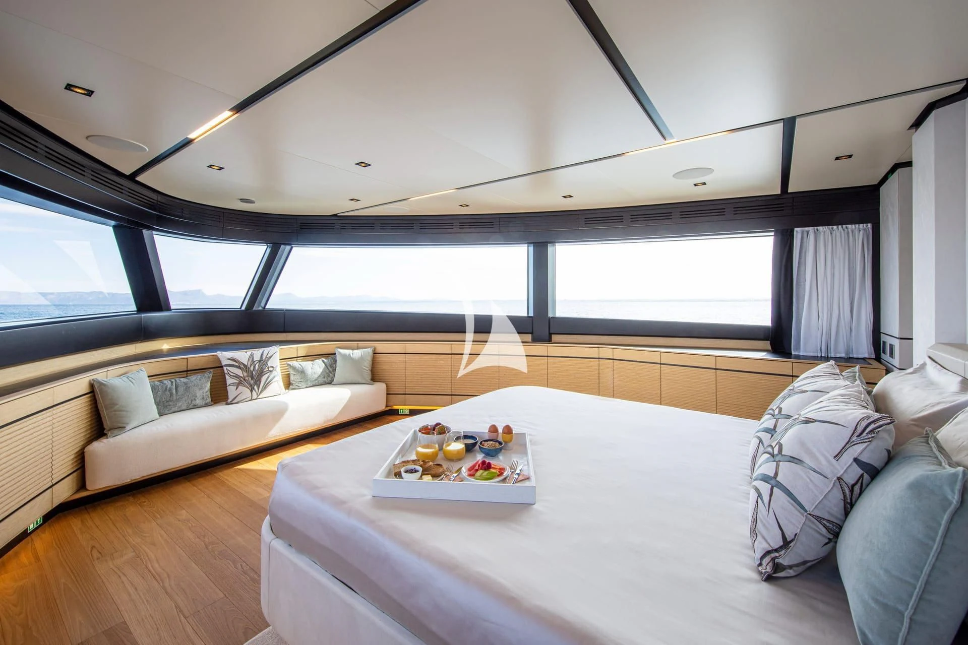 a room with a bed and a table with food on it aboard WHY 200 Yacht for Sale