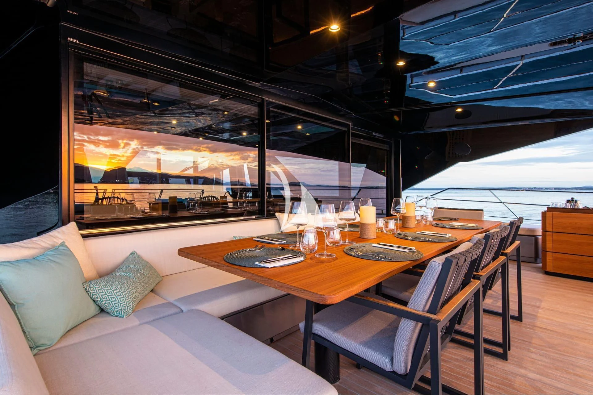 a table with a glass of wine on it aboard WHY 200 Yacht for Sale