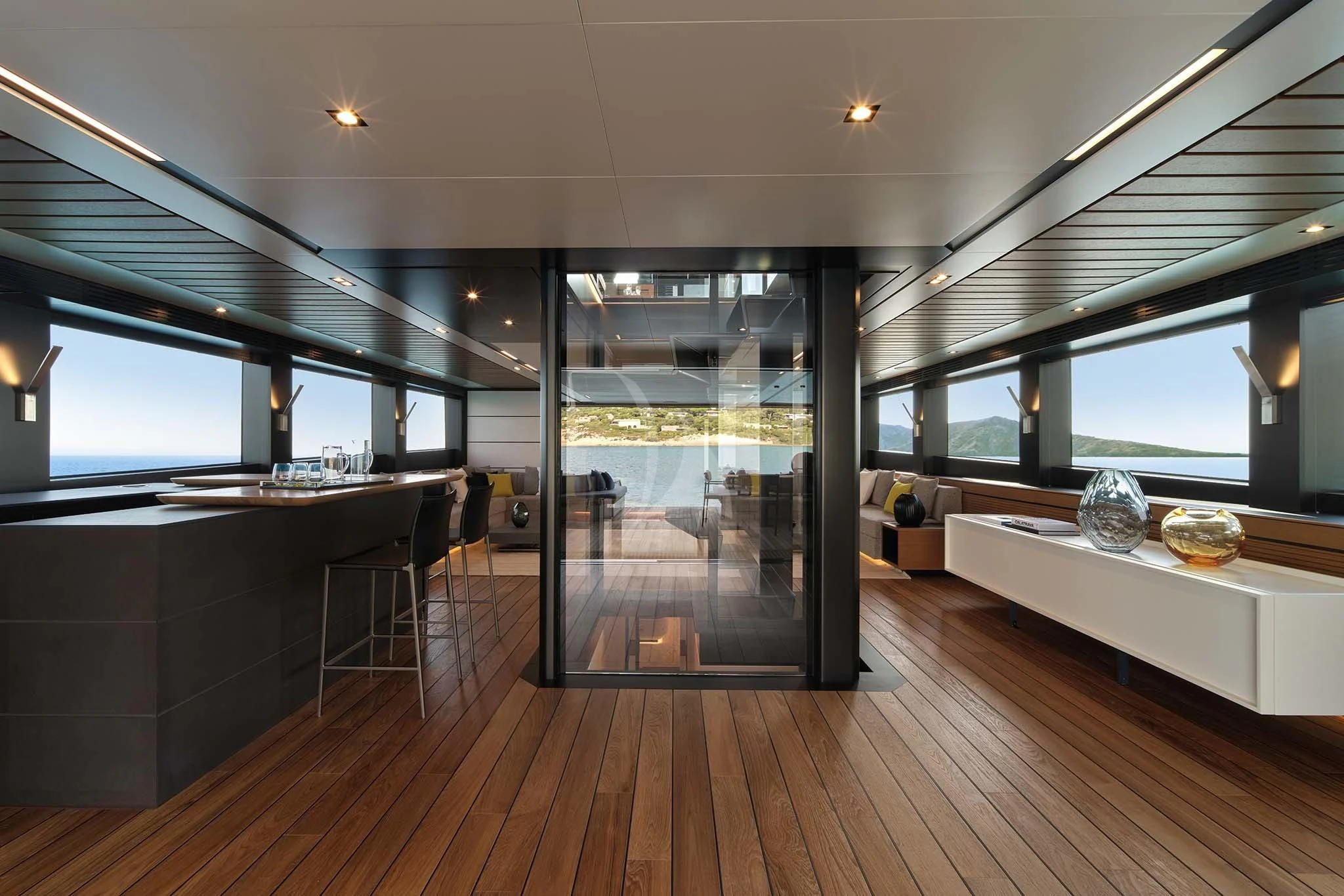 a room with a wood floor and a large glass door aboard WHY 200 Yacht for Sale