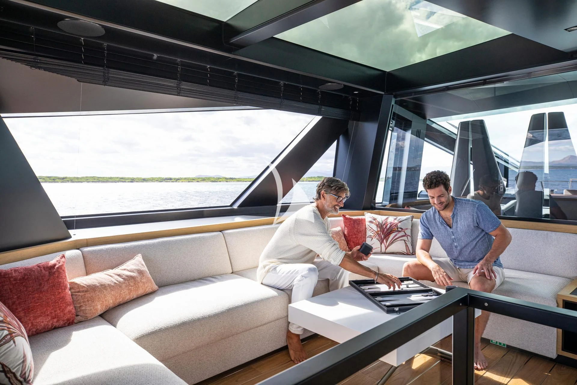 men sitting on a couch aboard WHY 200 Yacht for Sale