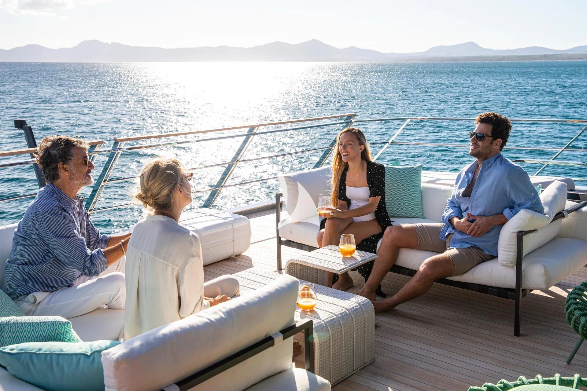 a group of people sitting on a boat aboard WHY 200 Yacht for Sale