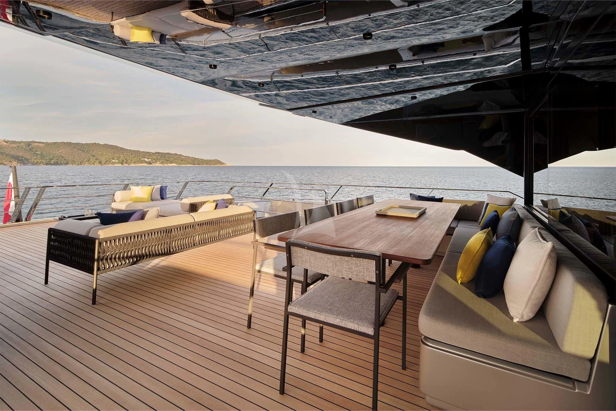 a deck with a table and chairs on it aboard WHY 200 Yacht for Sale