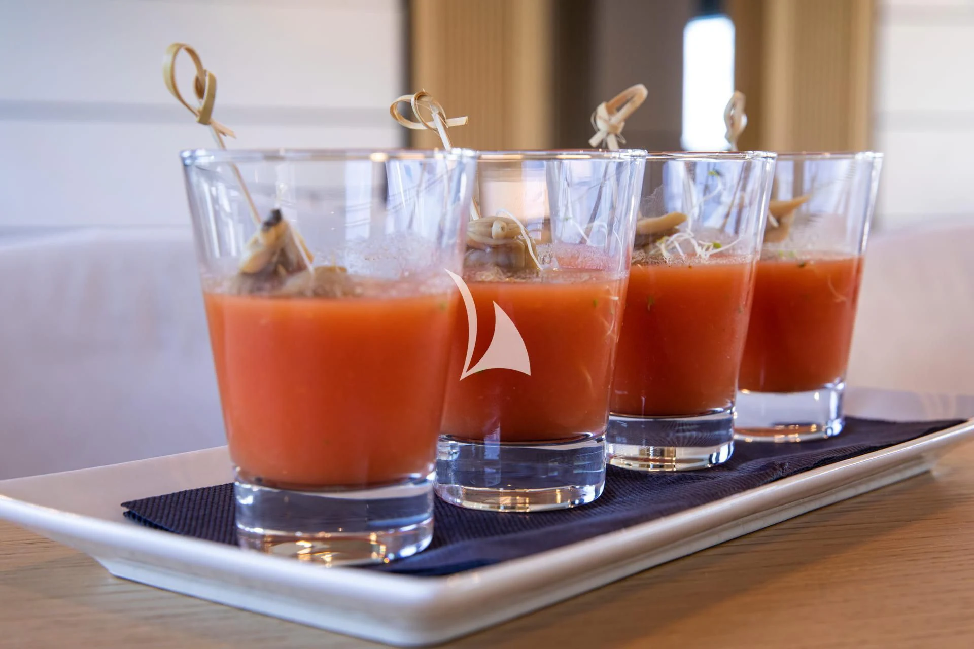 a group of glasses with liquid in them aboard WHY 200 Yacht for Sale