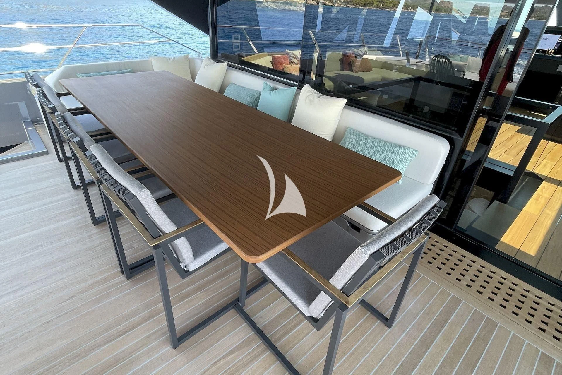 a wood table with chairs on it aboard WHY 200 Yacht for Sale