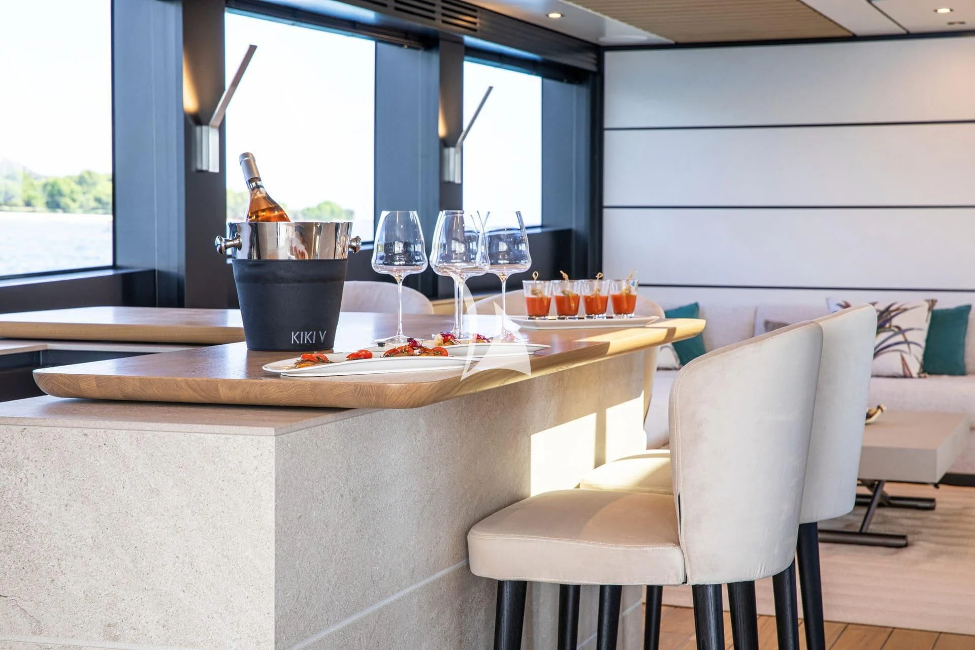 a table with wine glasses on it aboard WHY 200 Yacht for Sale