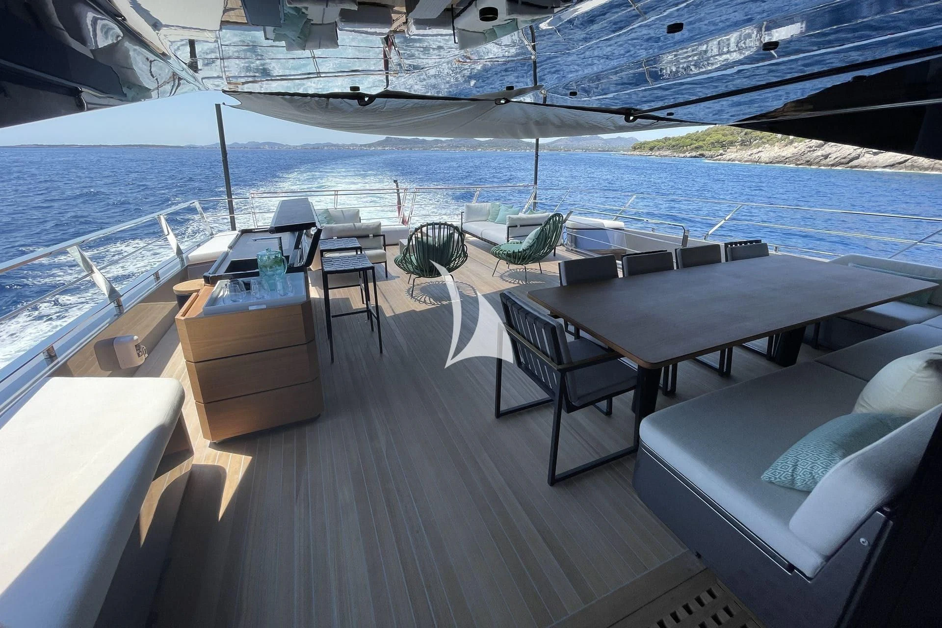 a deck with chairs and tables on it aboard WHY 200 Yacht for Sale