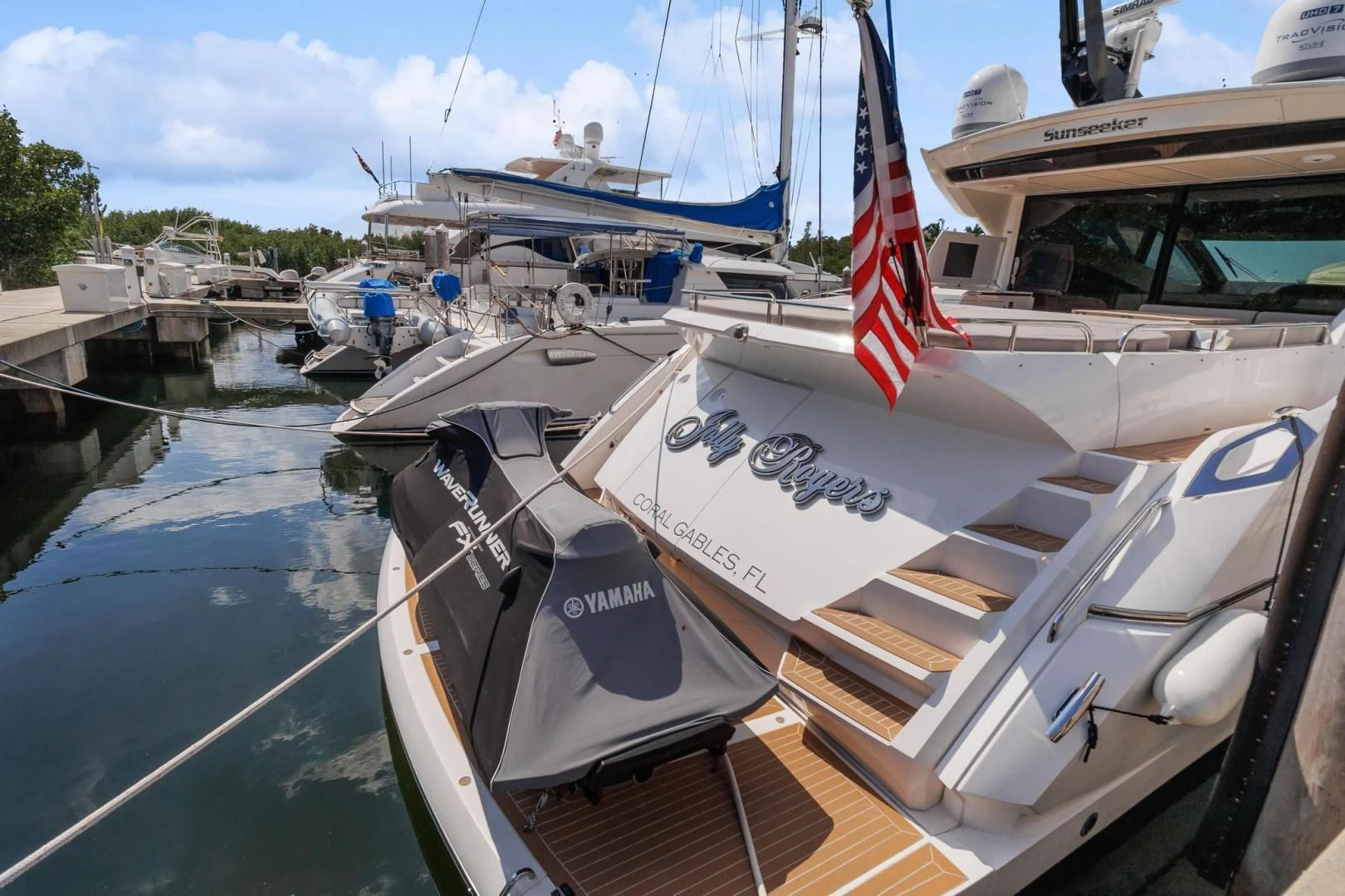 a boat with a flag on the front aboard JOLLY ROGERS Yacht for Sale