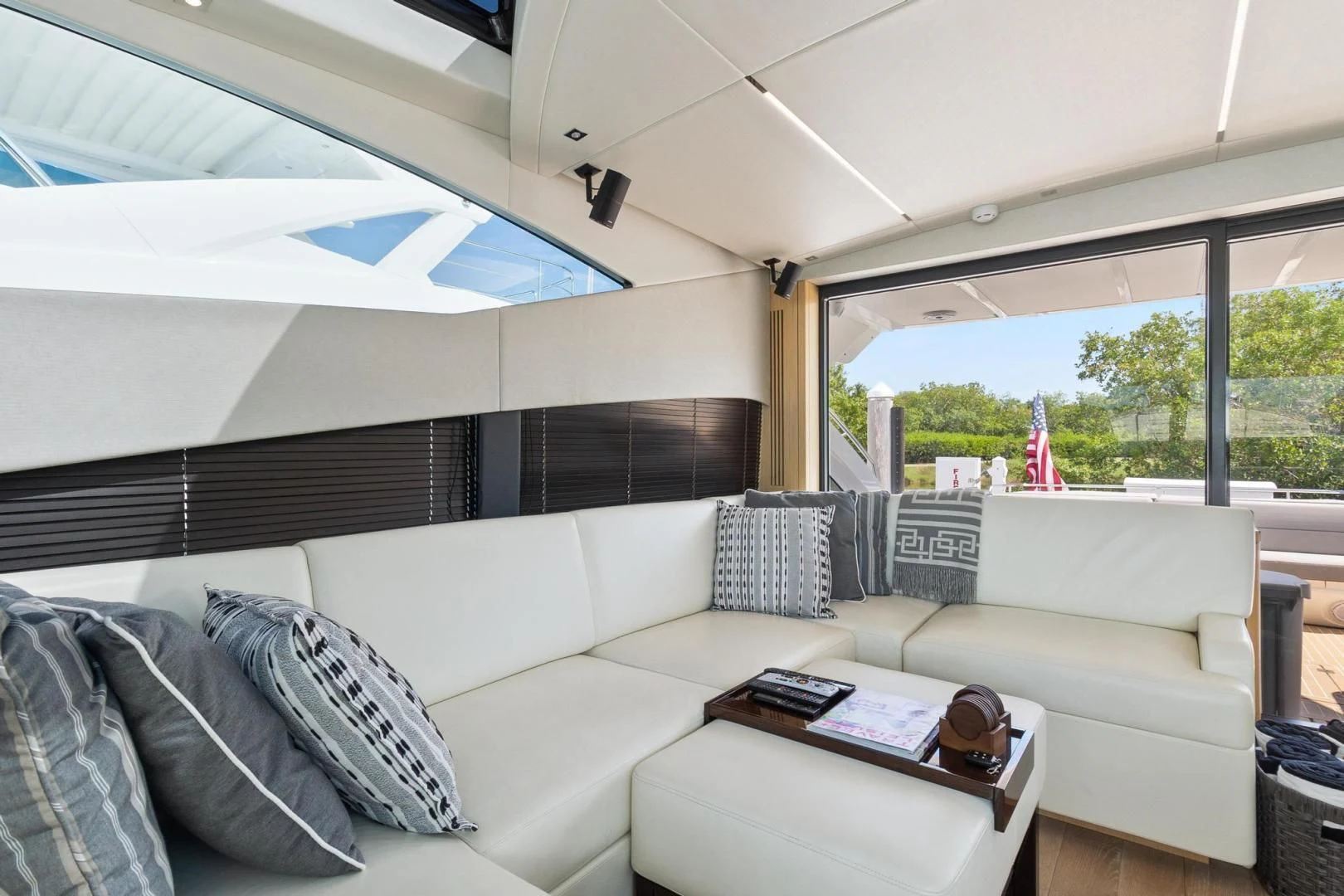 a living room with a large window aboard JOLLY ROGERS Yacht for Sale