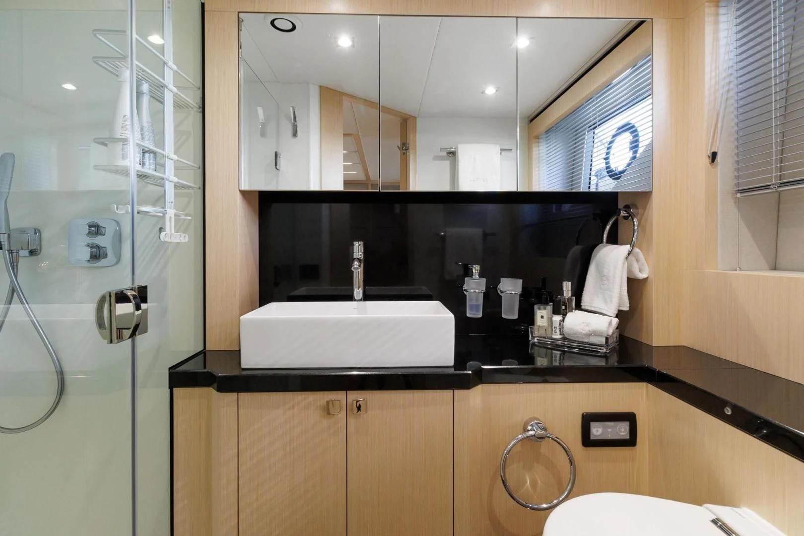 a bathroom with a large mirror aboard JOLLY ROGERS Yacht for Sale