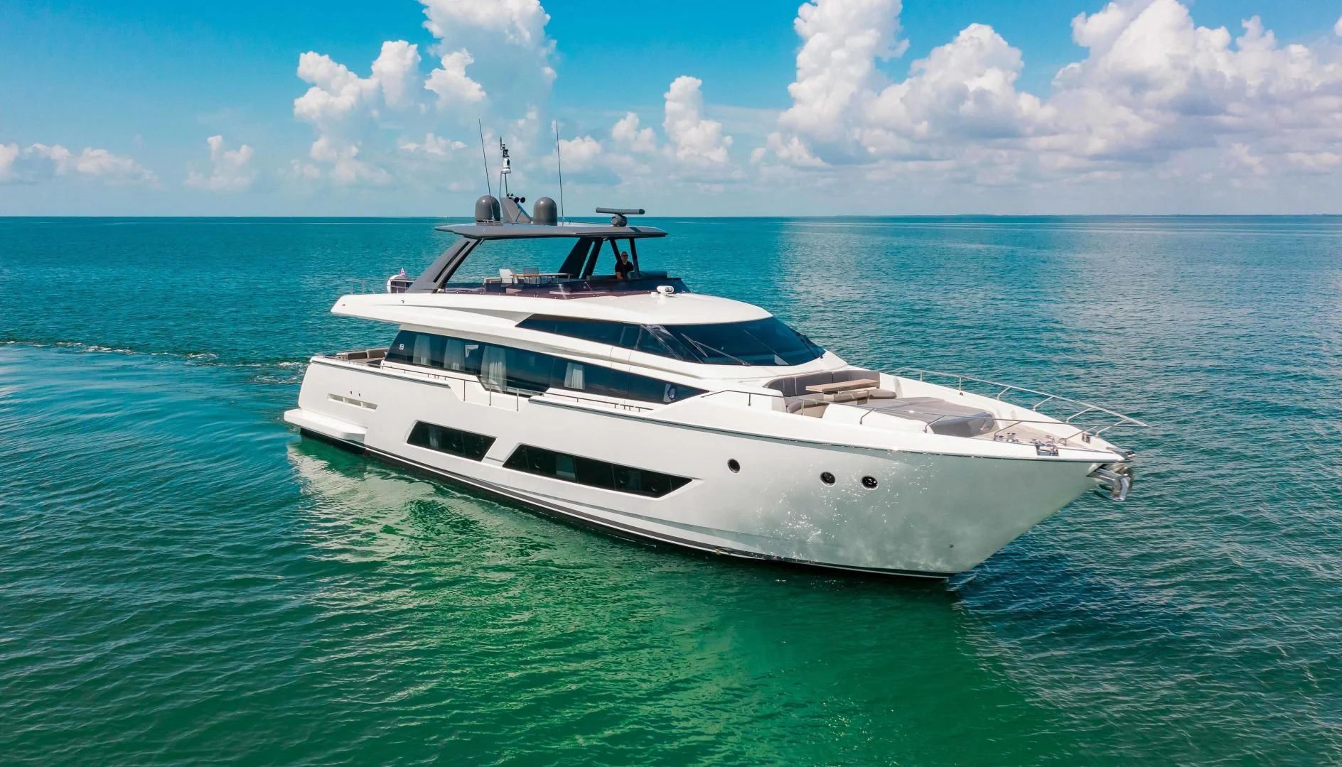 a white yacht in the water aboard CRAZY Yacht for Sale