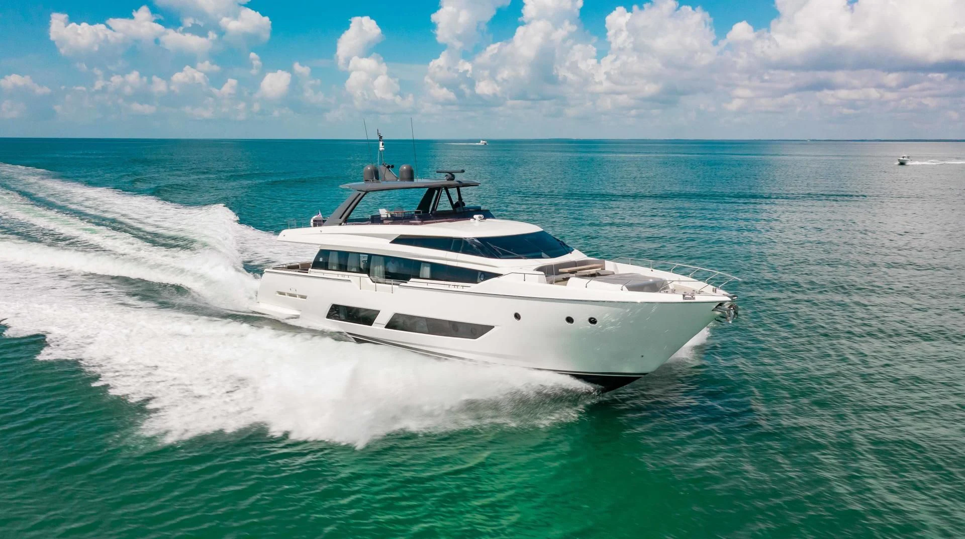 a white yacht on the water aboard CRAZY Yacht for Sale