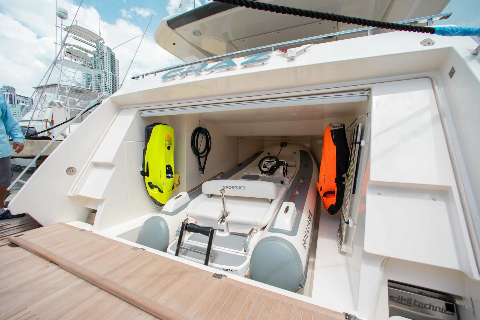 a boat with a yellow and black sail on it aboard CRAZY Yacht for Sale
