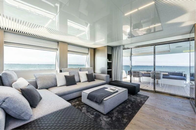 a living room with a large window aboard CRAZY Yacht for Sale