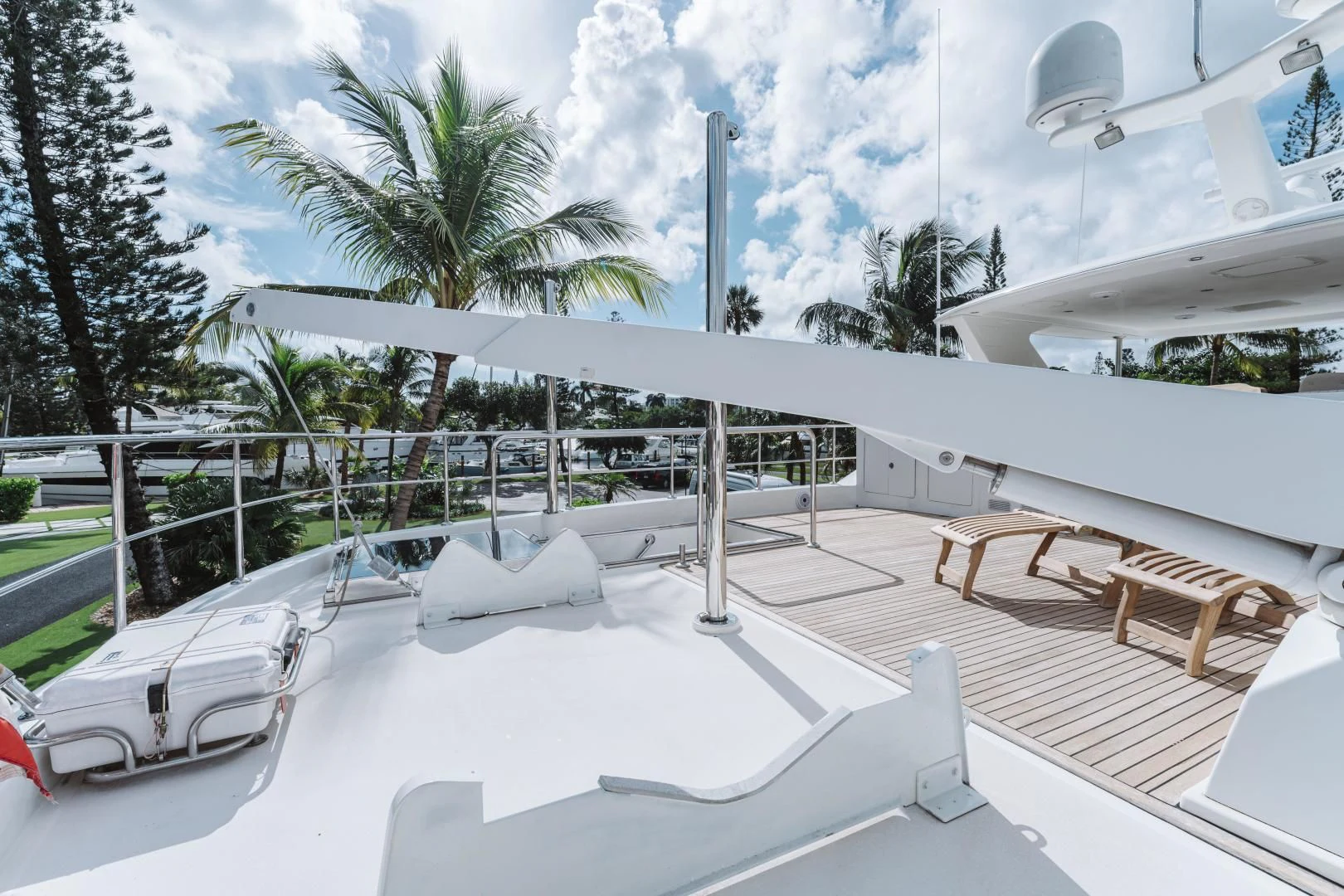 a pool with chairs and trees aboard SKULLDUGGERY Yacht for Sale