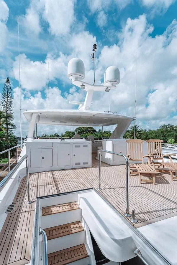 a white satellite dish on a deck aboard SKULLDUGGERY Yacht for Sale