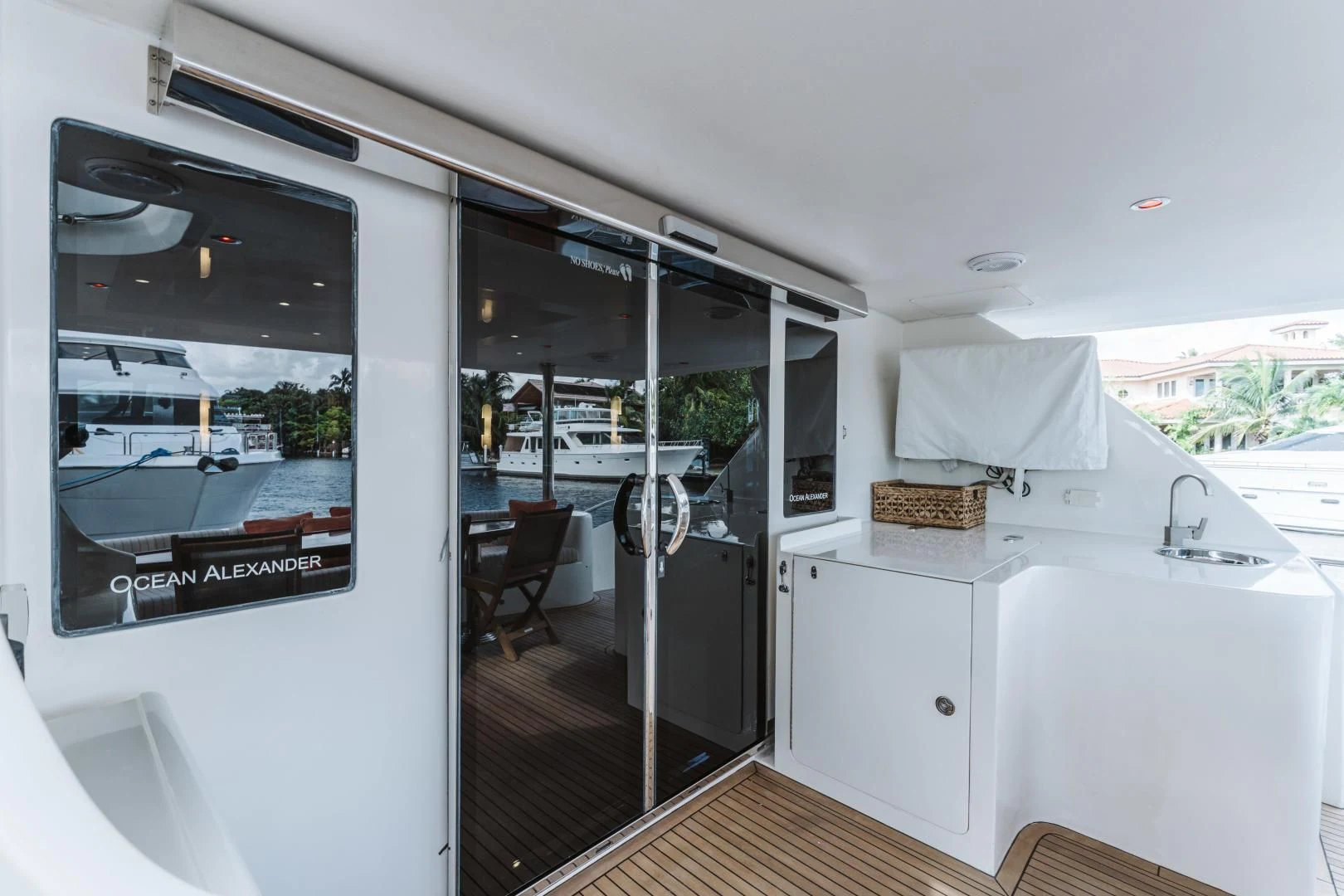 a kitchen with a sliding glass door aboard SKULLDUGGERY Yacht for Sale