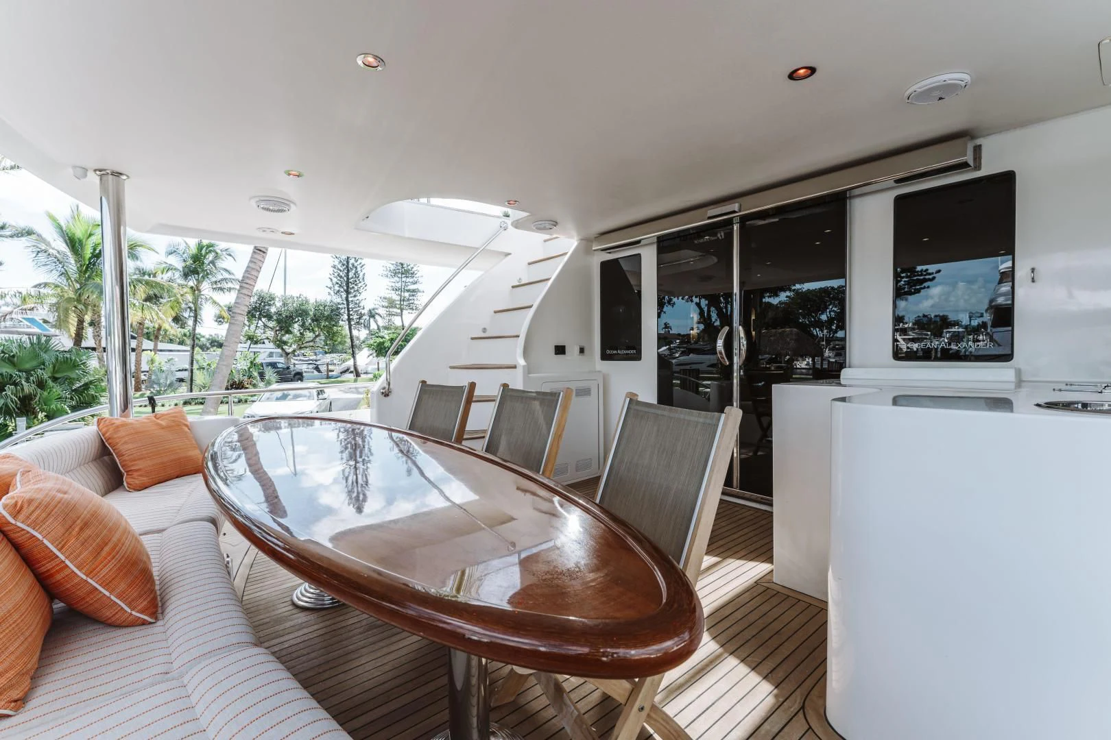 a large living room with a table and chairs aboard SKULLDUGGERY Yacht for Sale