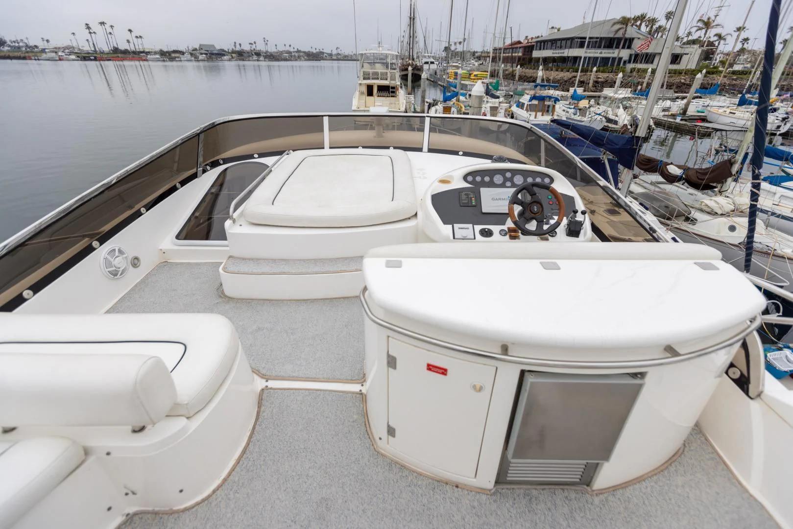 a group of boats sit in a harbor aboard DREAM BIG Yacht for Sale
