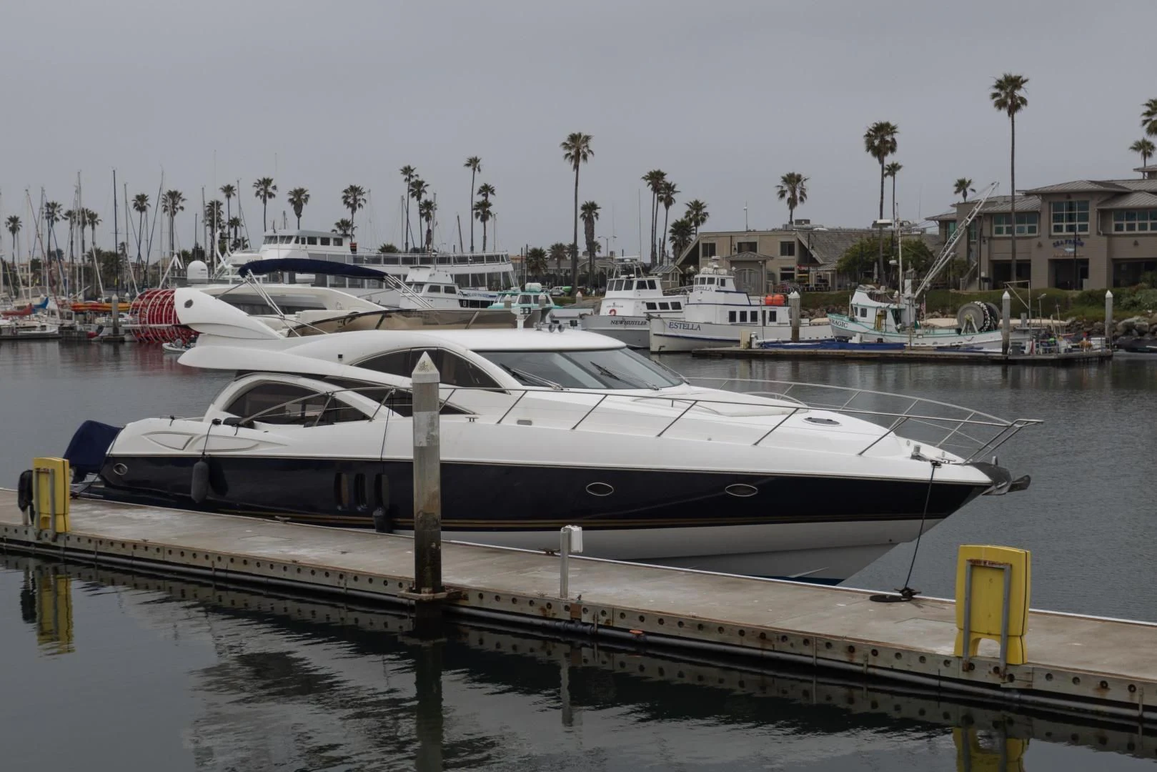 a boat docked at a pier aboard DREAM BIG Yacht for Sale