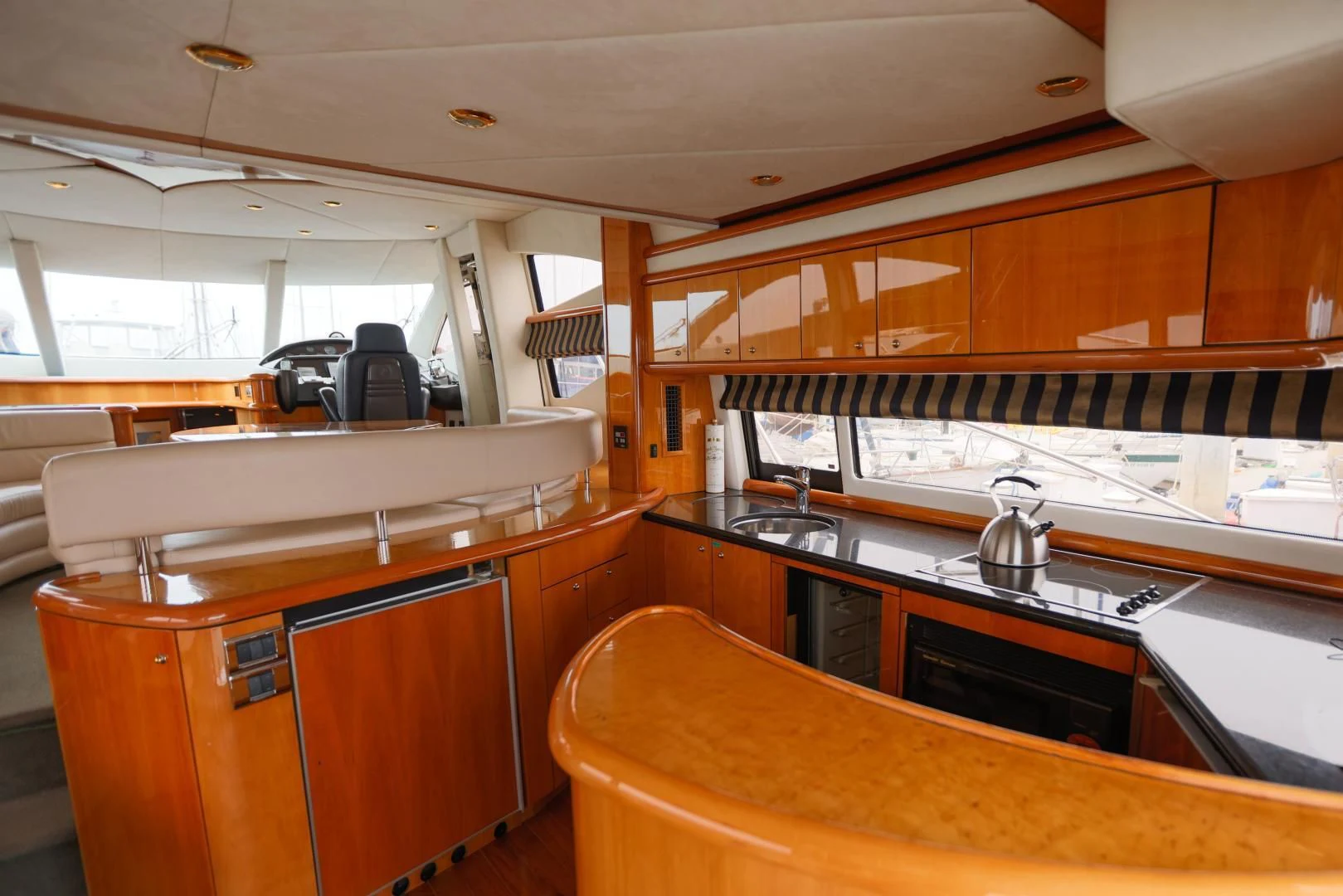 a kitchen with wooden cabinets aboard DREAM BIG Yacht for Sale
