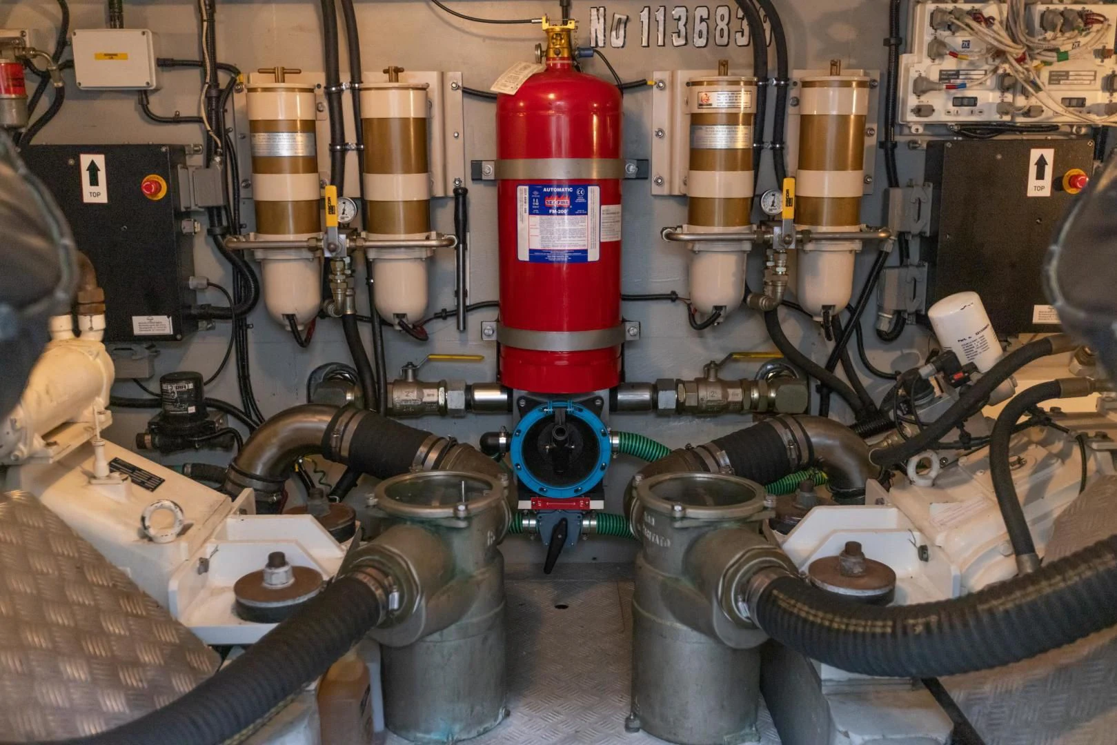a red and white fire extinguisher in a factory aboard DREAM BIG Yacht for Sale