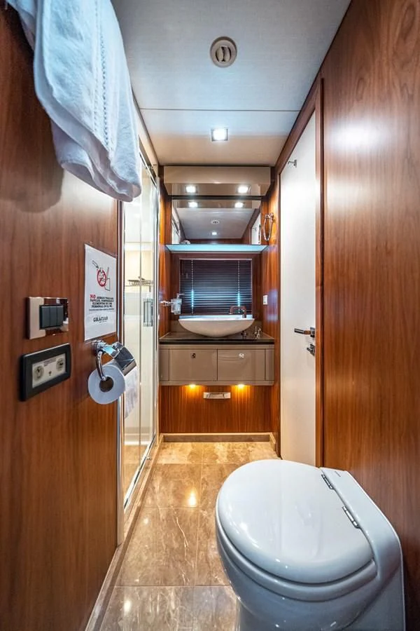 a bathroom with a toilet and a sink aboard SUNSEEKER 84 Yacht for Sale