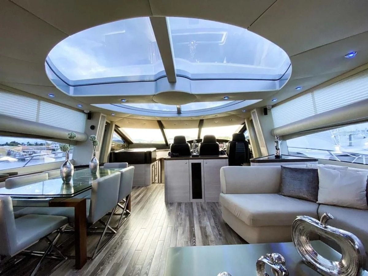 a room with a table chairs and a large window aboard SUNSEEKER 84 Yacht for Sale