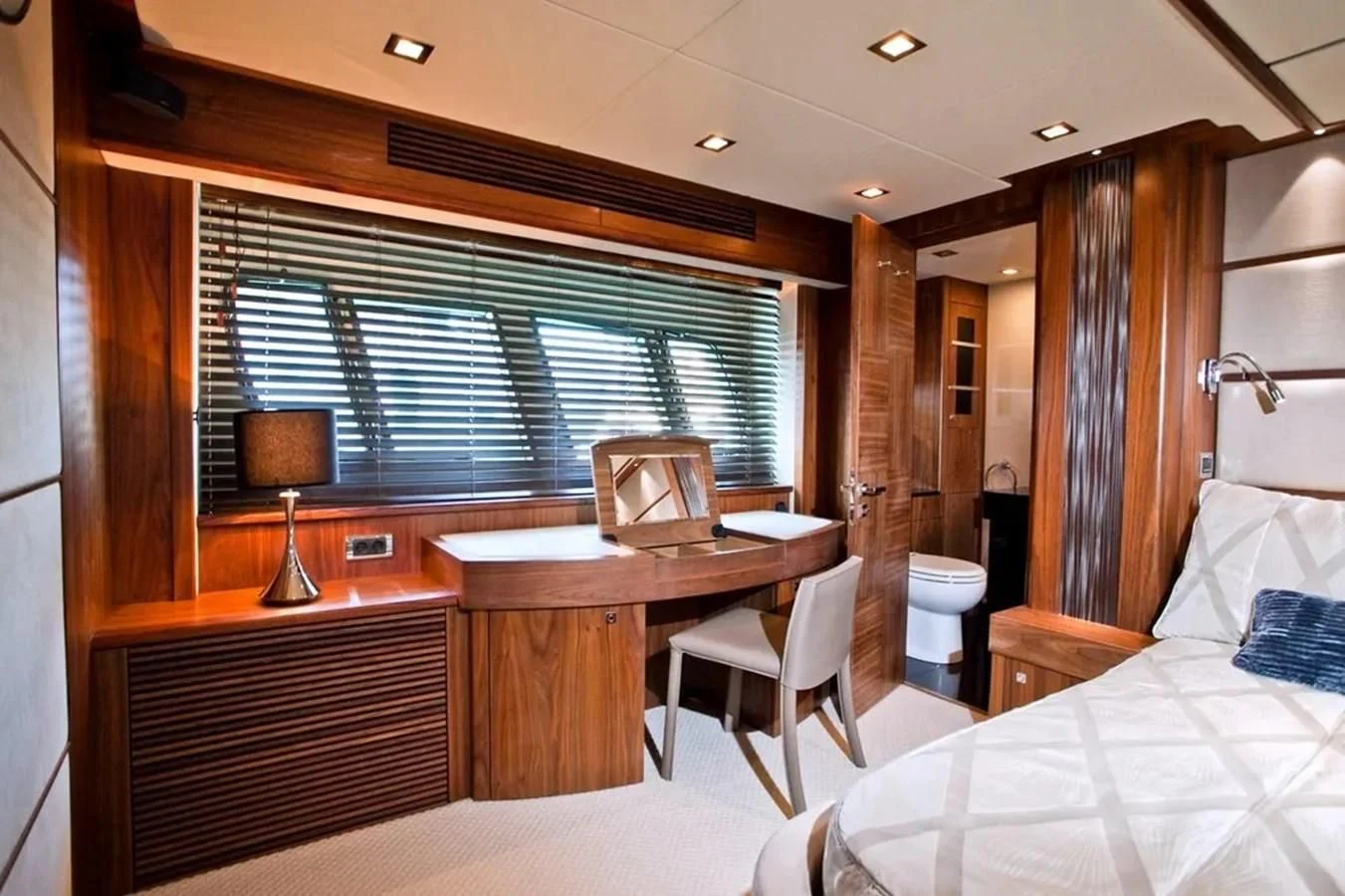 a bedroom with a bed and a desk aboard SUNSEEKER 84 Yacht for Sale