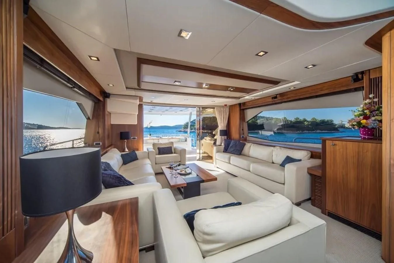 a room with a couch and a pool aboard SUNSEEKER 84 Yacht for Sale